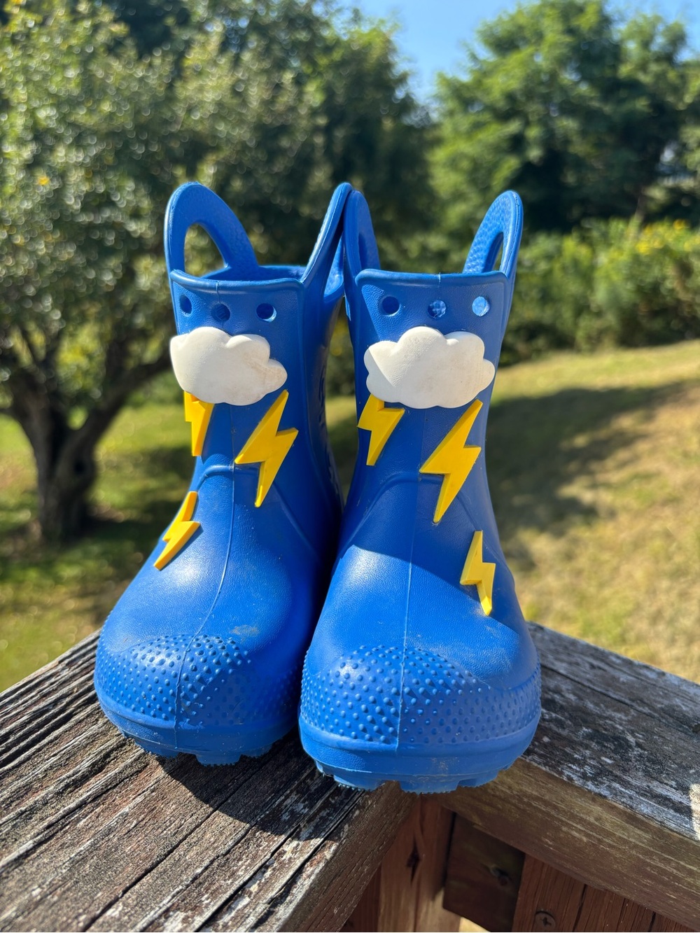 CROCS Toddler Blue Rain Boots with Yellow Lightning and White Clouds